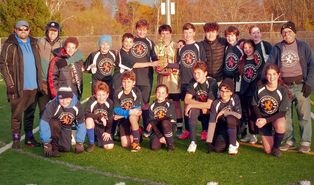 heilicher soccer team poses with first place trophy
