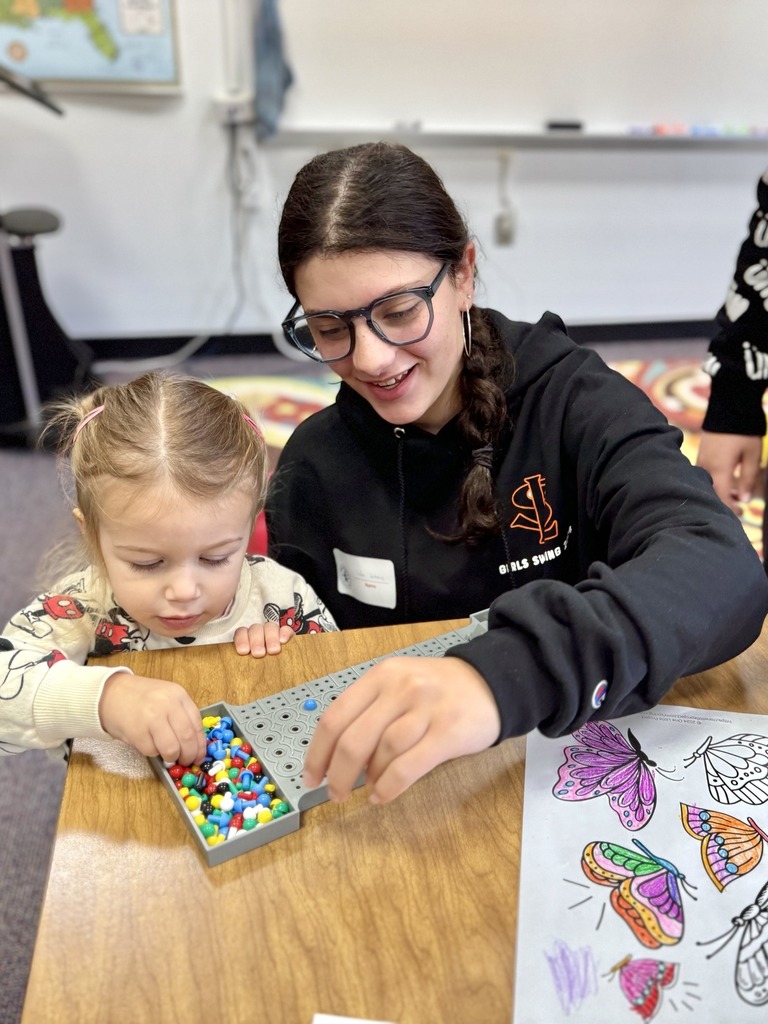 eighth grader plays with child