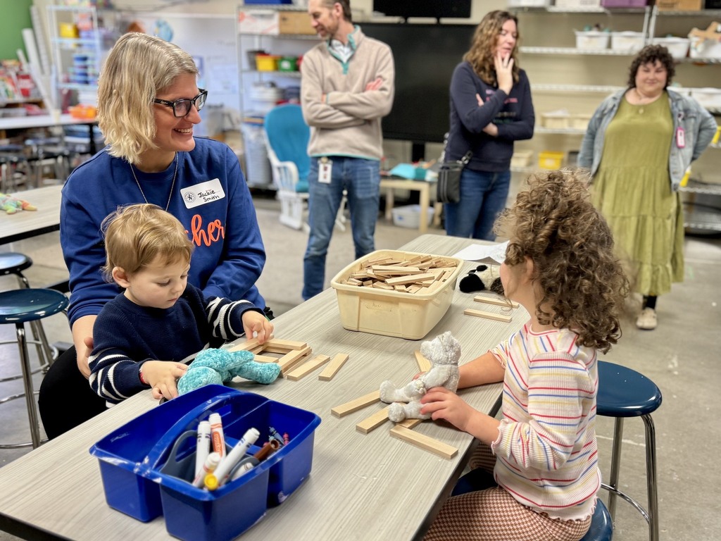 general studies director engages with children in Makerspace