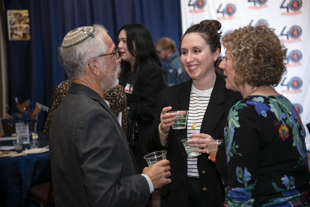 benefit attendees chat over drinks
