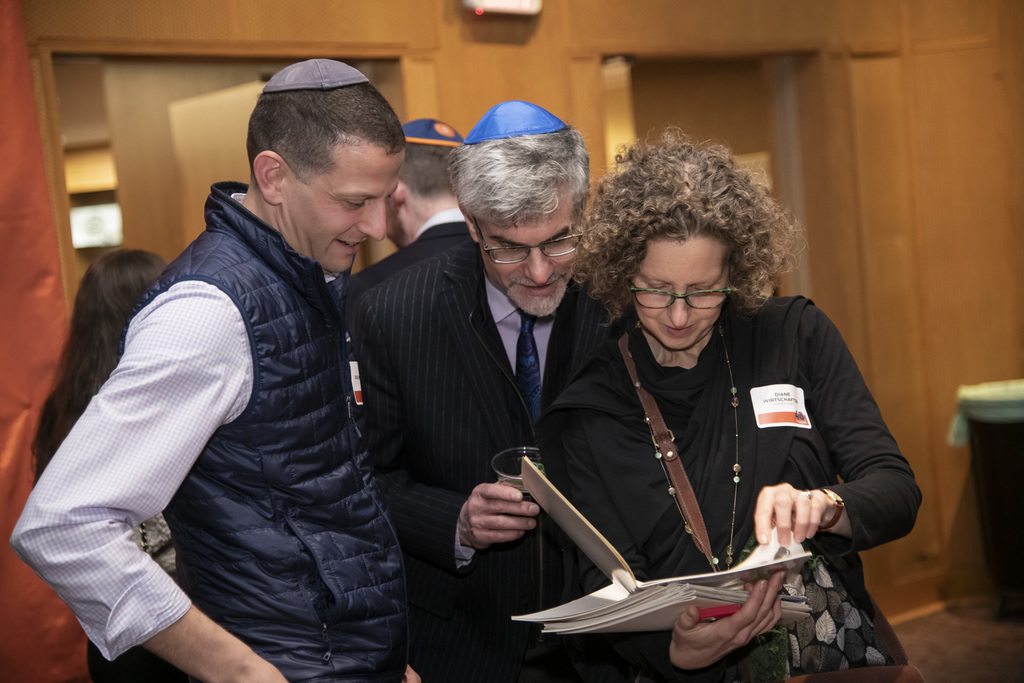 Benefit attendees peruse past yearbooks