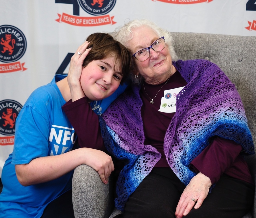 special guest cradles boy's head