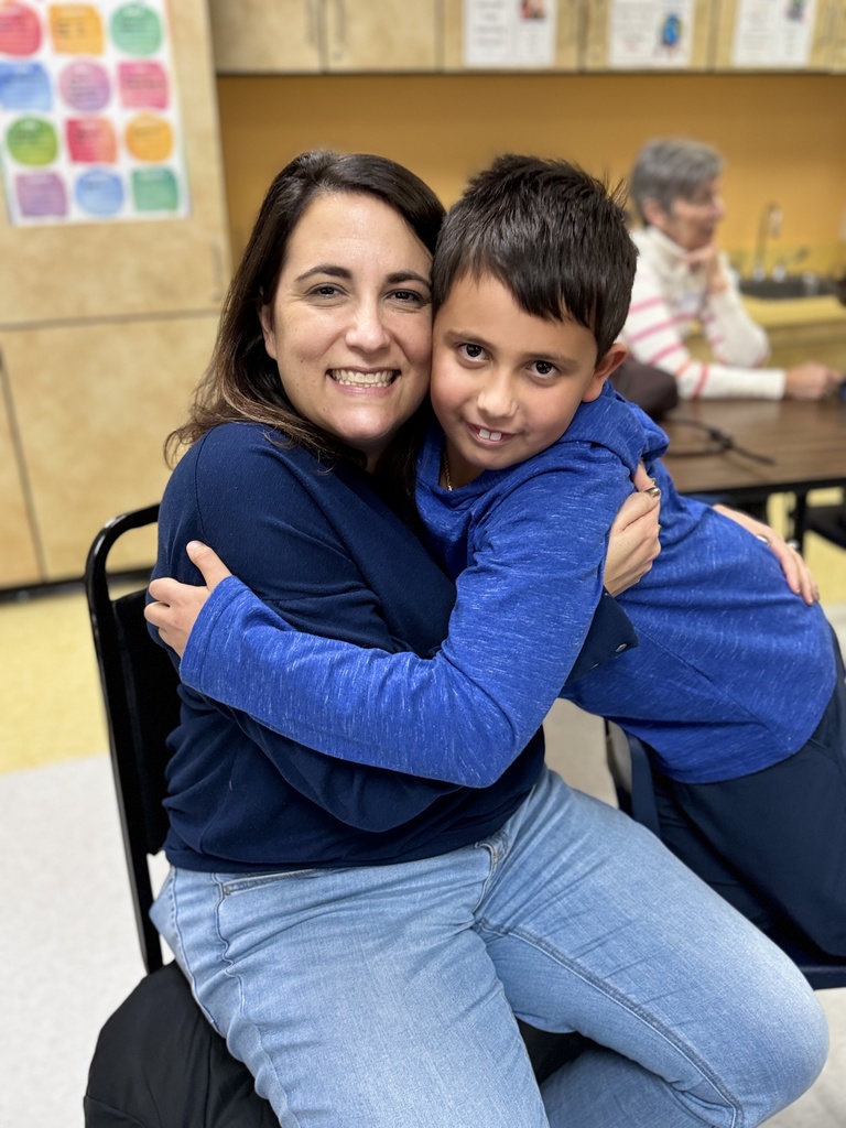boy and mother hug