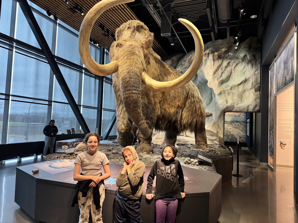 students in front of mammoth