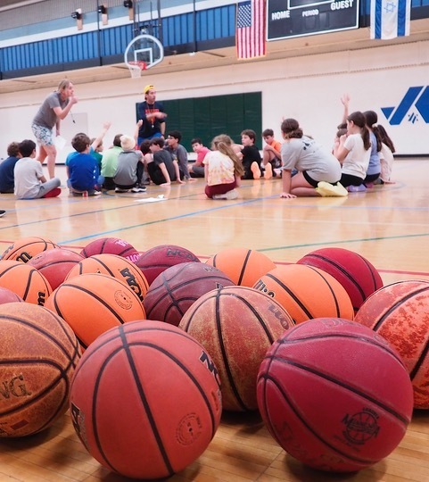 students and coaches meet