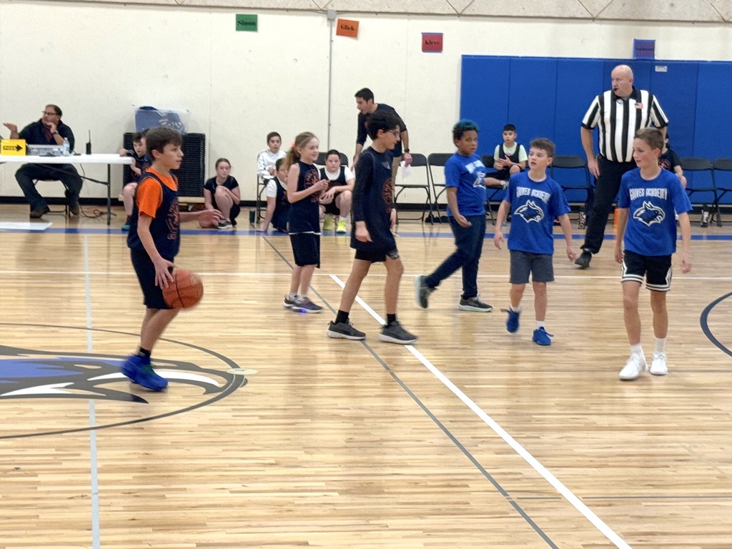 player dribbles basketball down the court