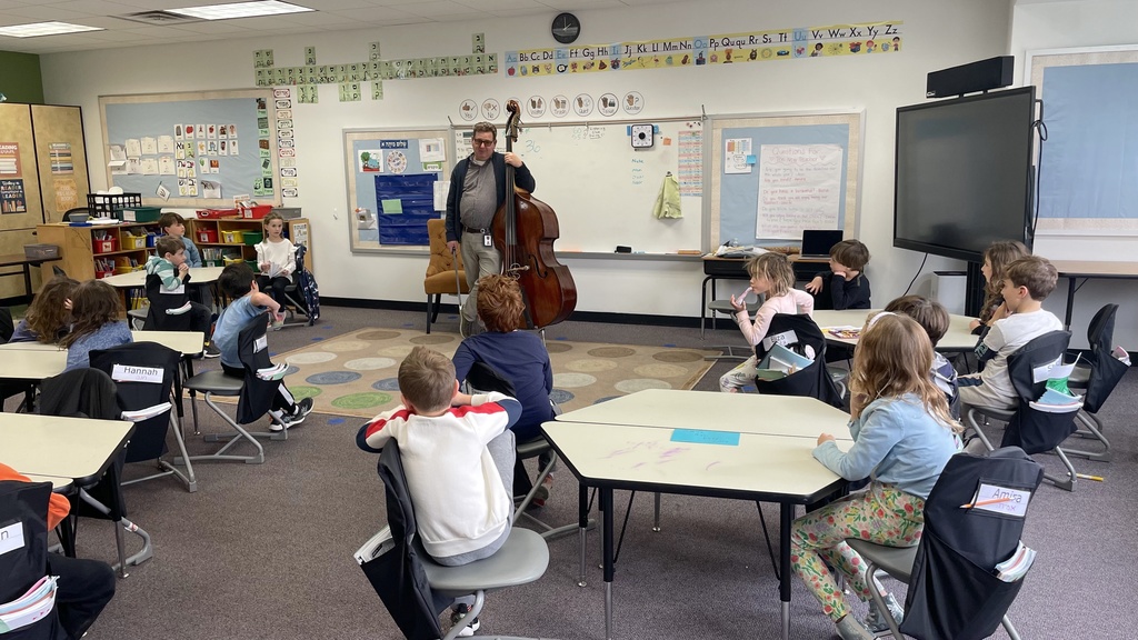 Dr. Dan and his bass in front of the first grade class