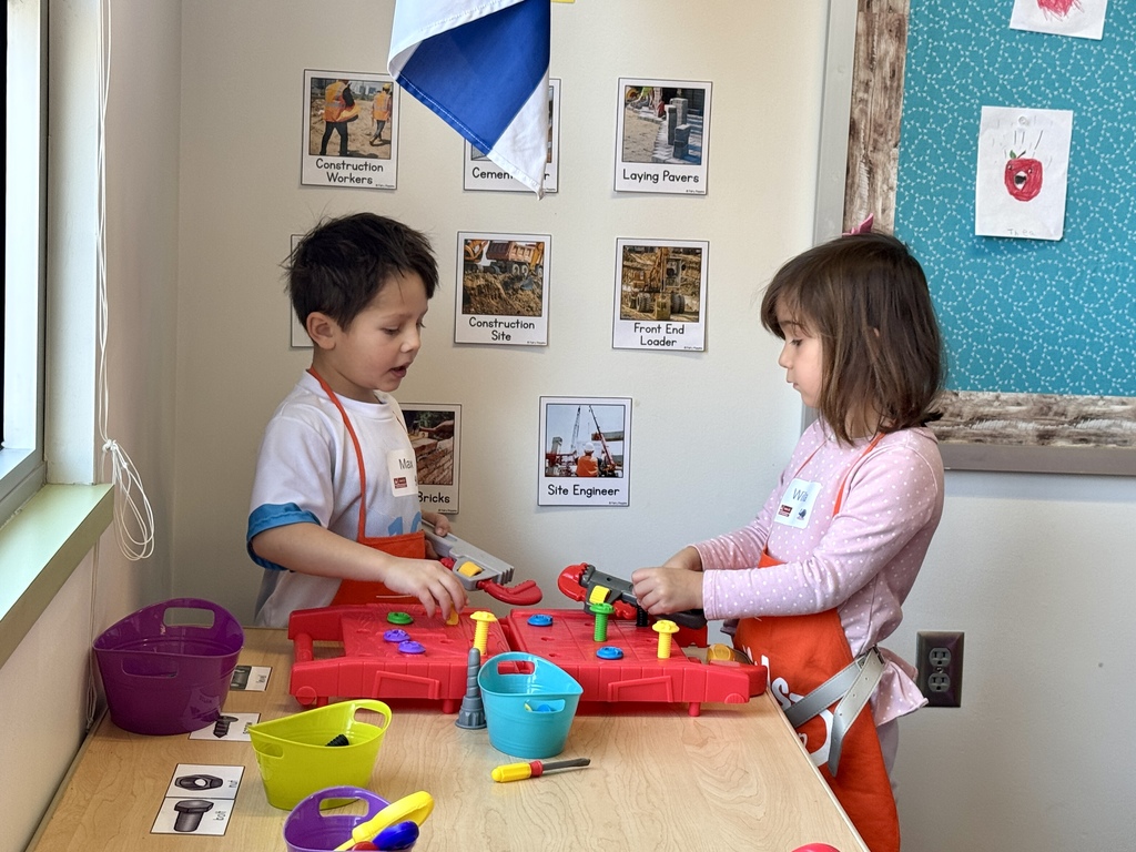 pre-k students play with fine motor skills hammer and nail toy