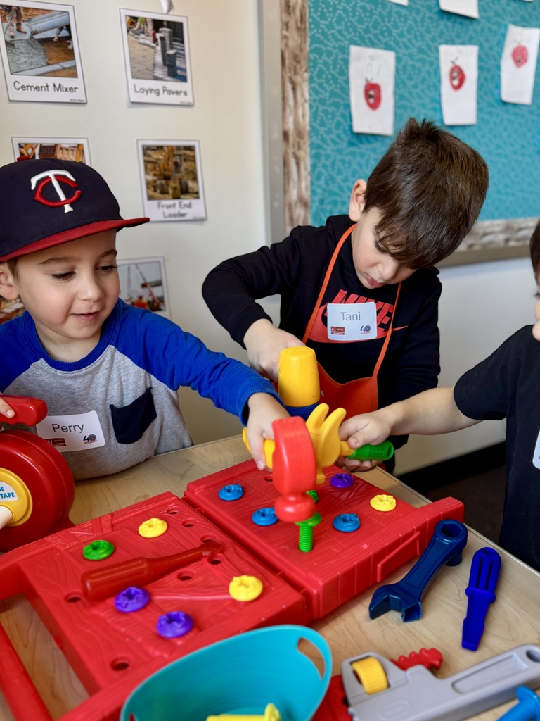 pre-k students hammer plastic nails