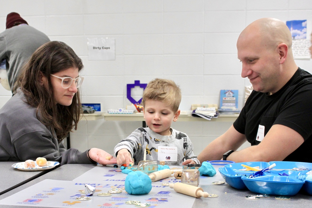 child plays with Chanukah sensory kit