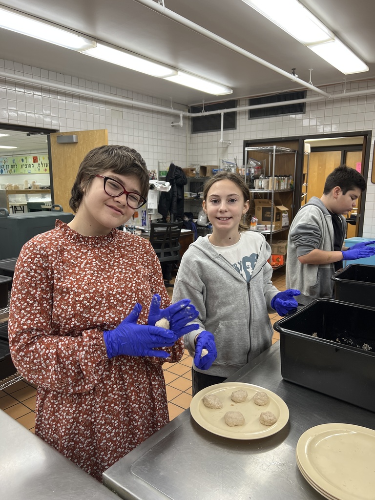 students roll dough