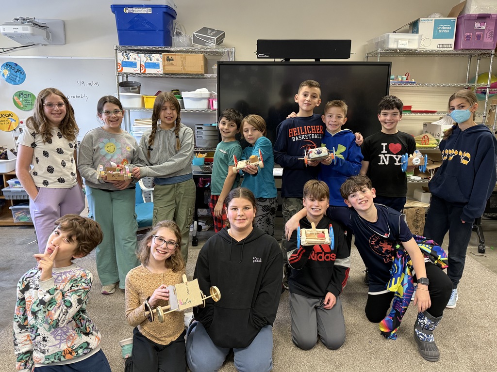 fifth-grade class poses with rovers