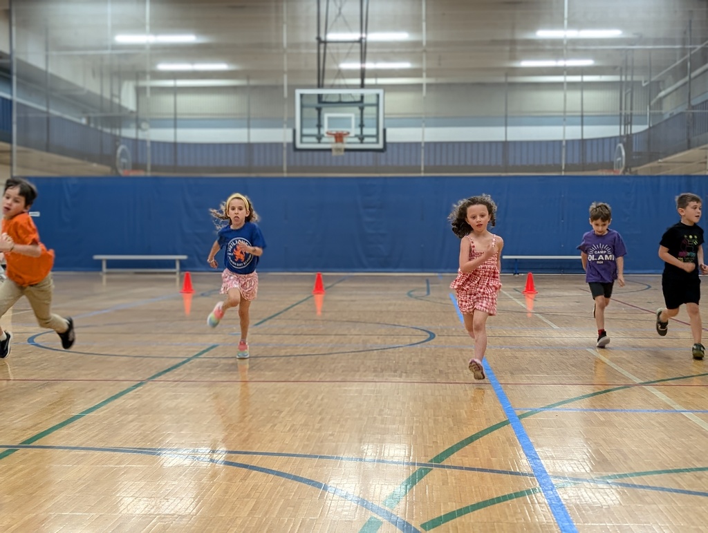first graders run in gym