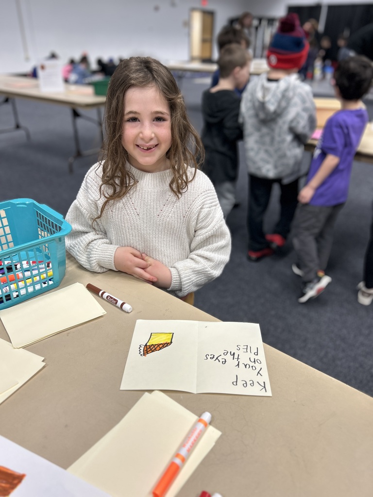 student writes and decorates card