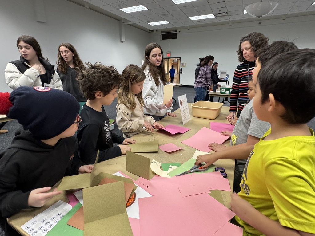 eighth grader gives instructions to younger students