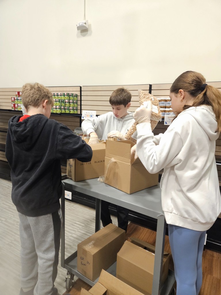 students unpack boxes