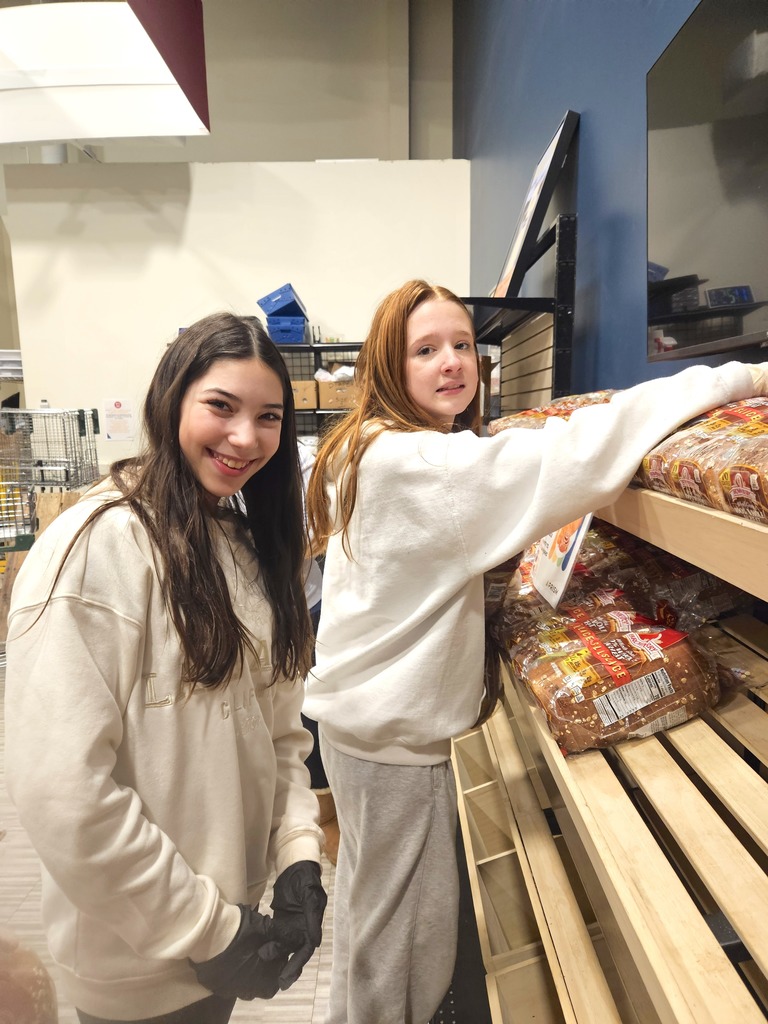 students organize shelves