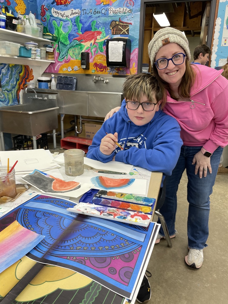 art volunteer and her son