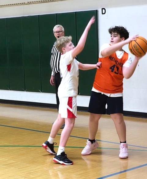 Heilicher basketball player looks to pass ball