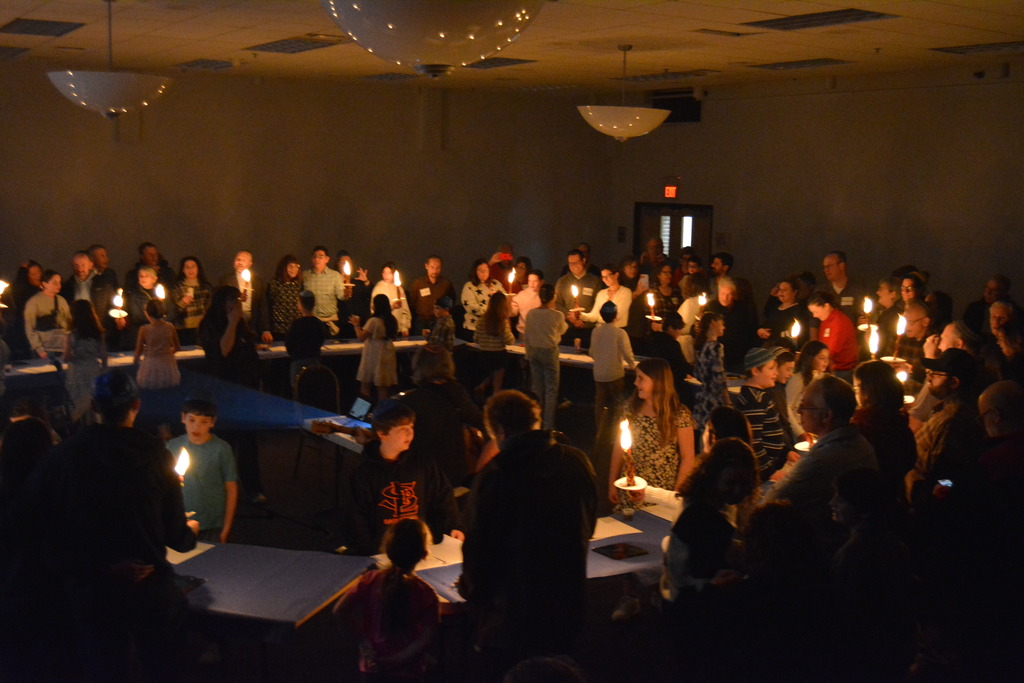 students and their families do Havdalah