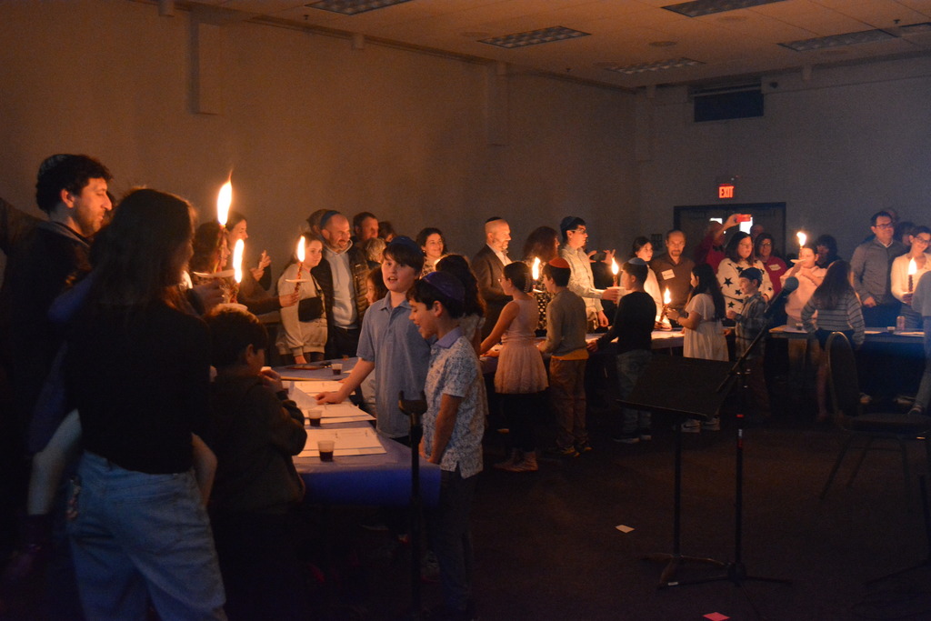 students and their families do Havdalah