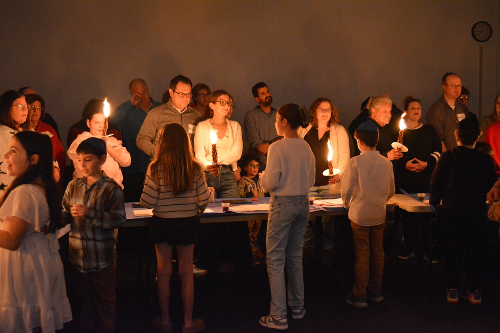 students and their families do Havdalah
