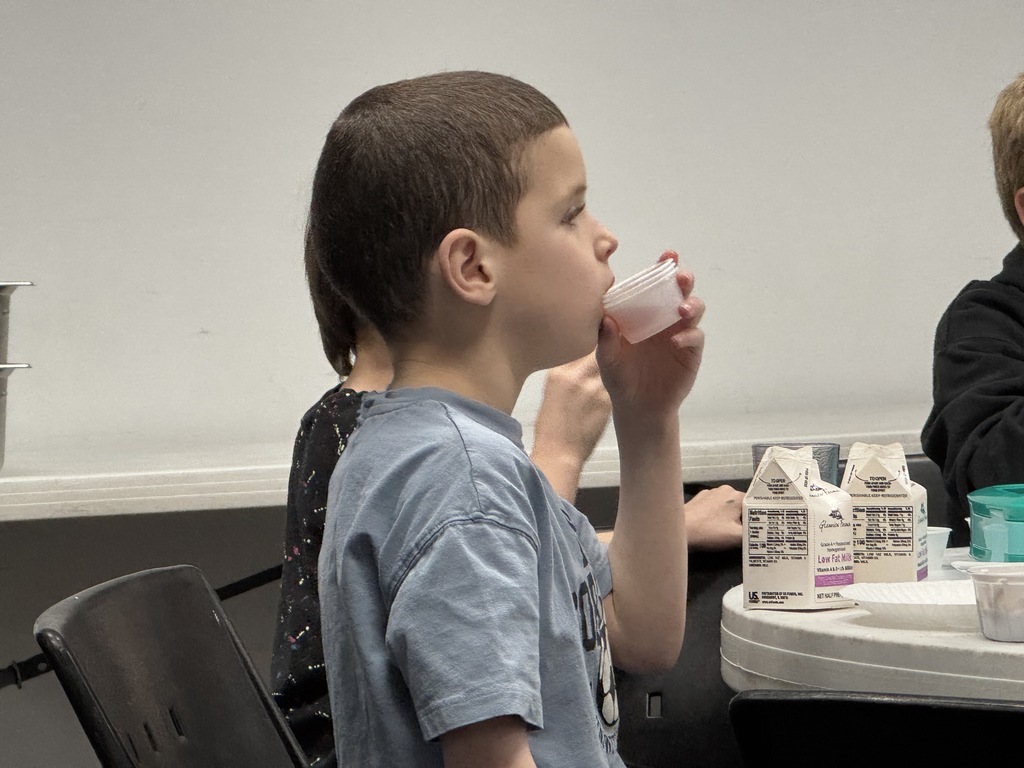 student drinks grape juice