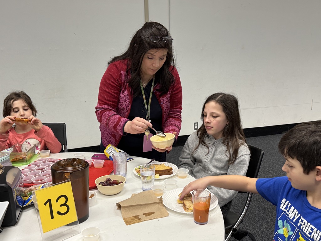 teacher serves pineapple to student