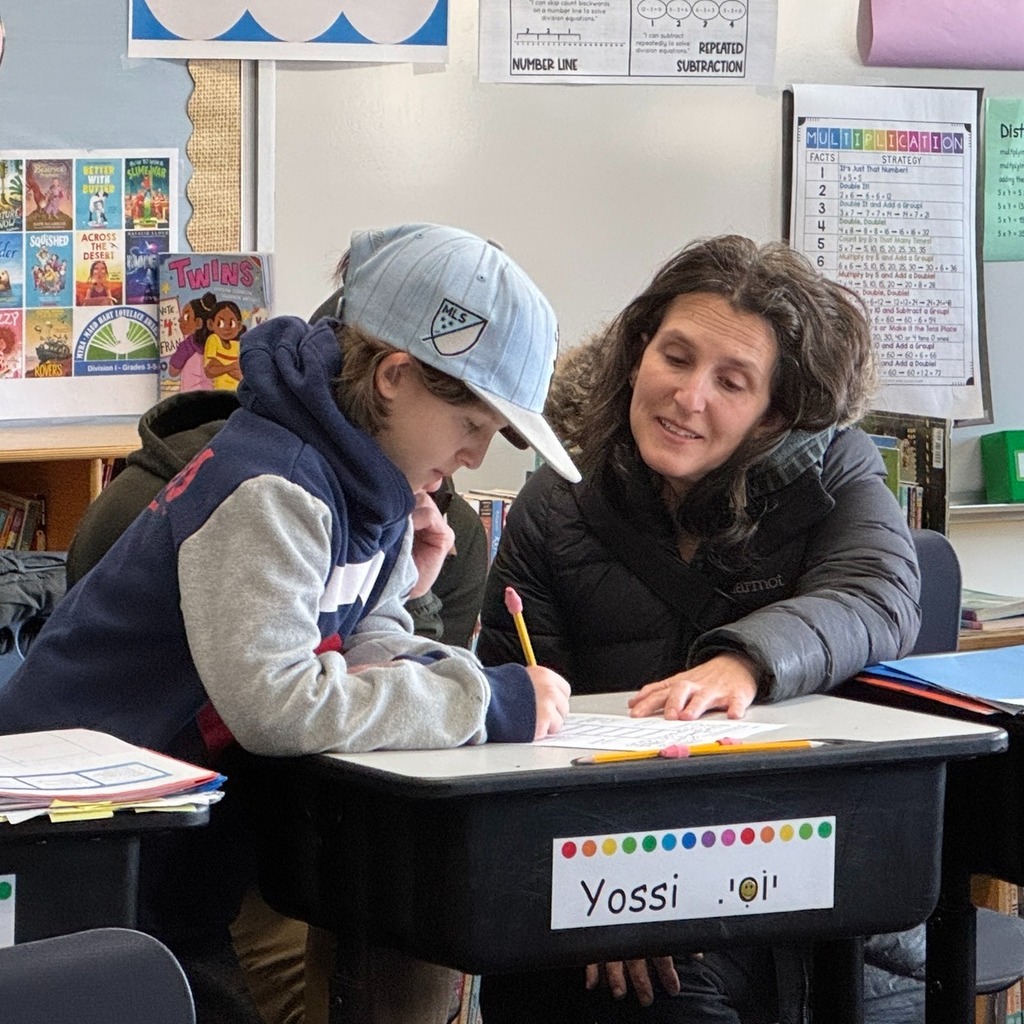 student completes worksheet with guest