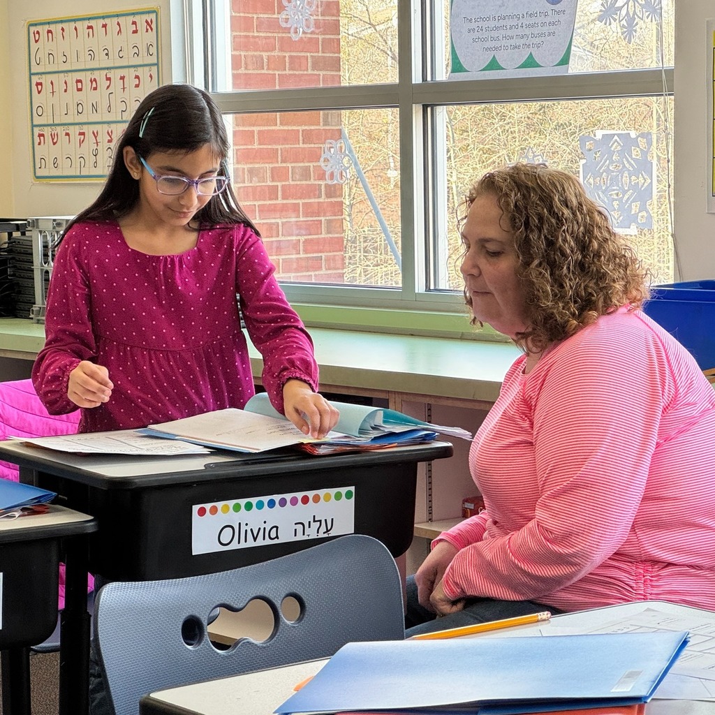 student shows work to guest