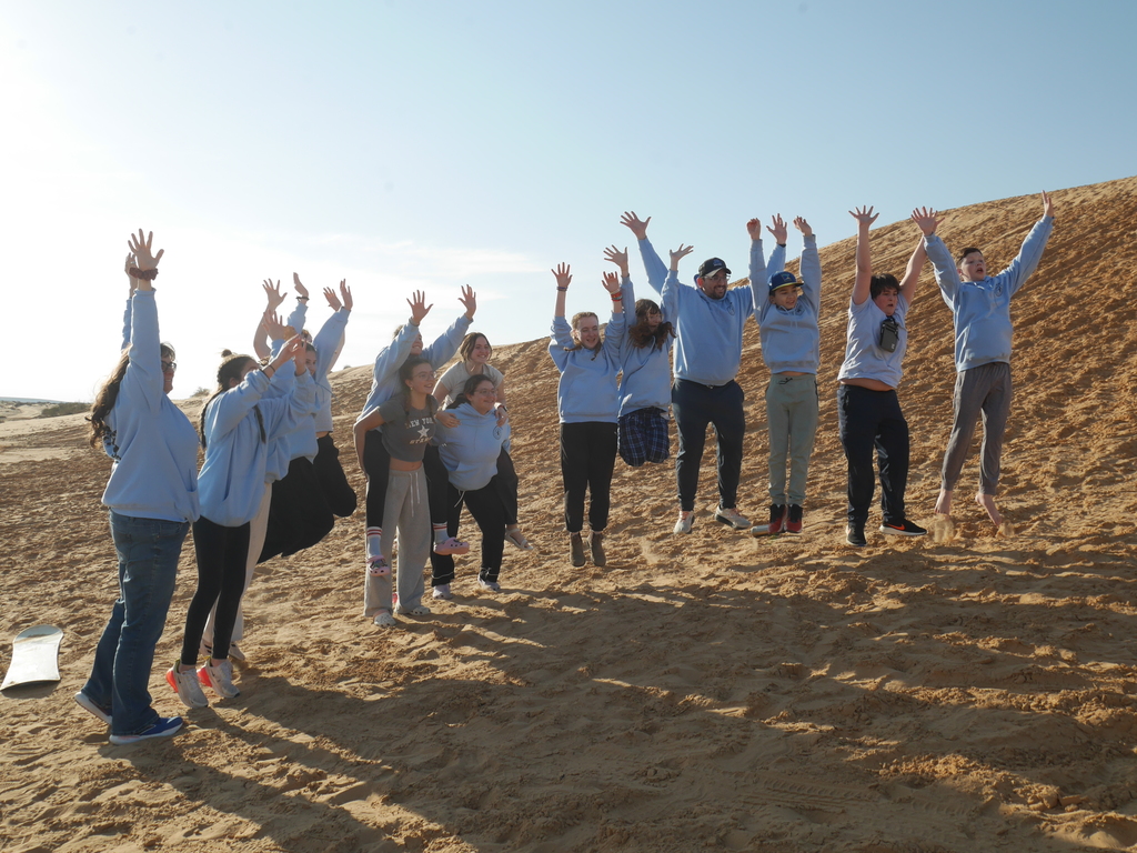 Aliyah Chet students and teachers jump in desert