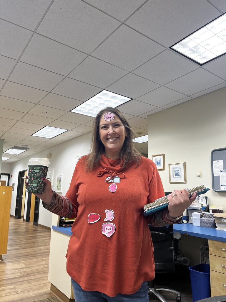 kindergarten teacher wears stickers of cartoon organs on her shirt — she's inside out!