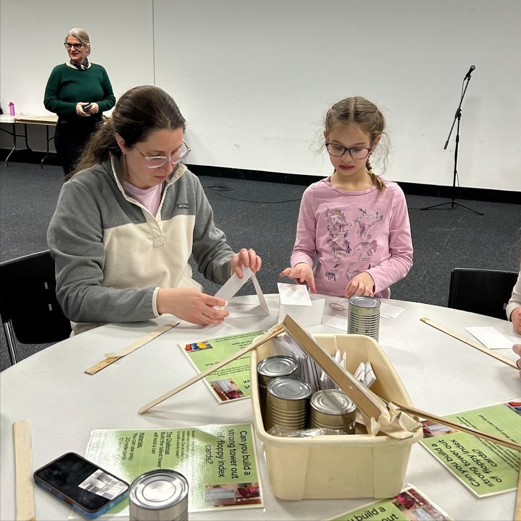 mother and daughter do building activity