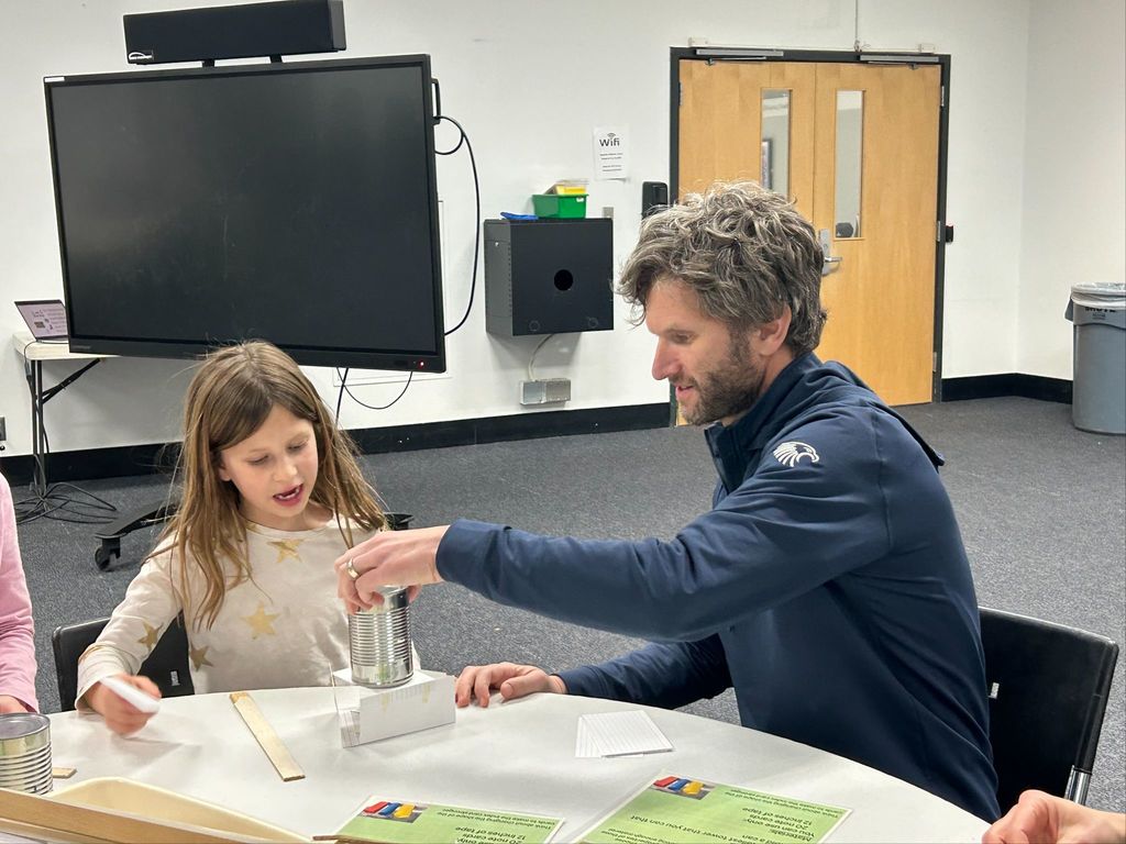 father and daughter do building activity
