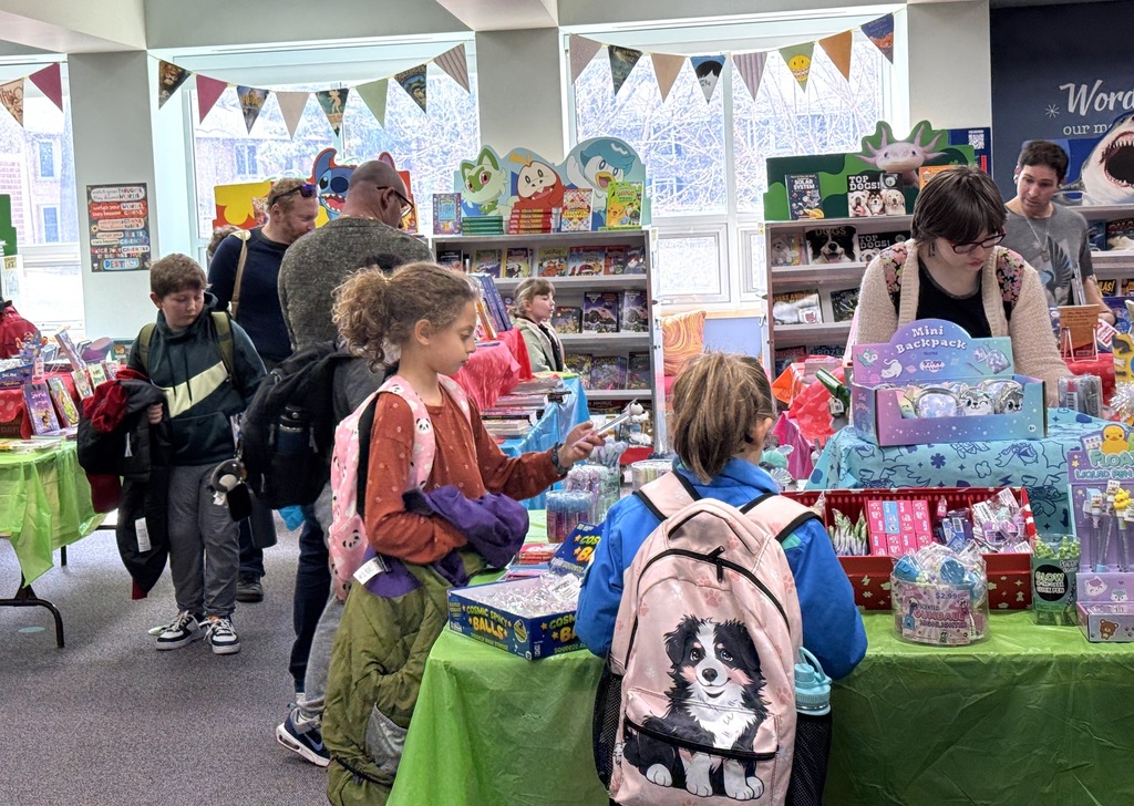 Students and parents peruse book fair