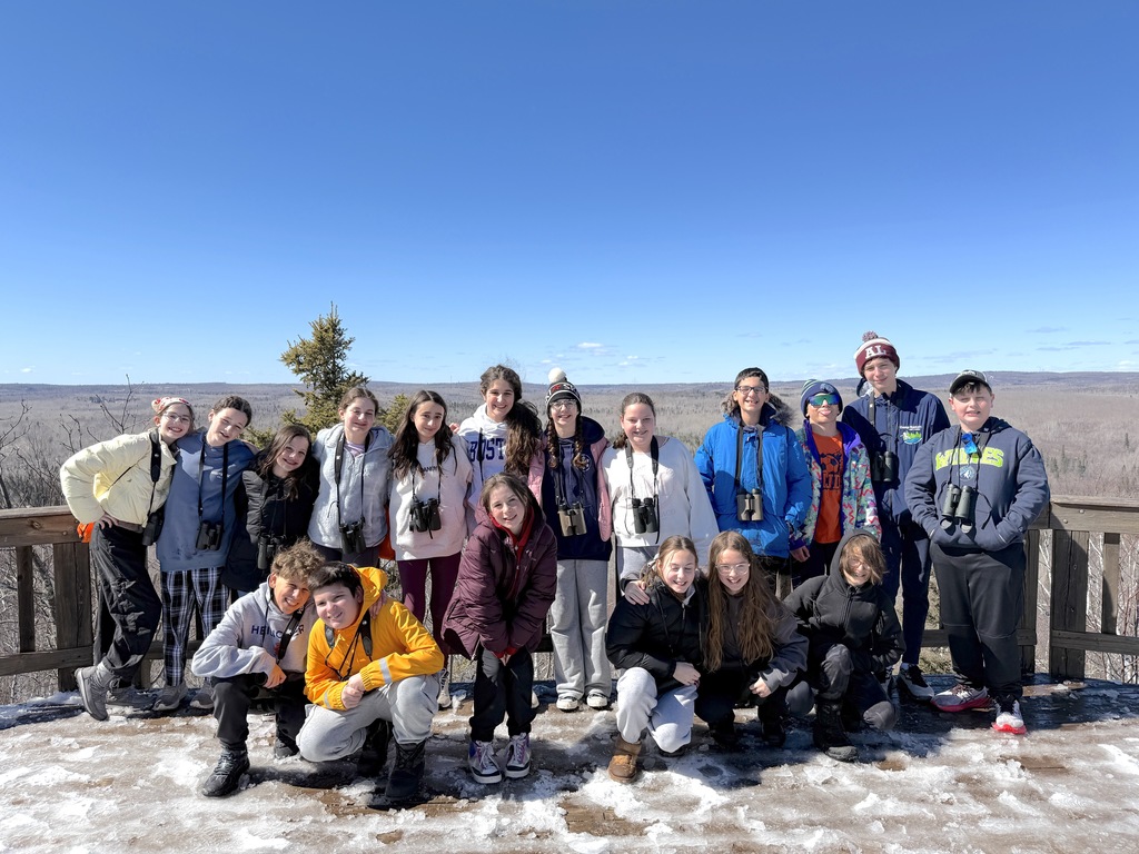 students take group picture at overlook