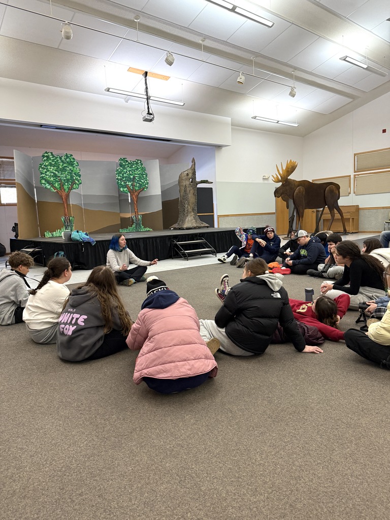 students listen to wolf ridge staff