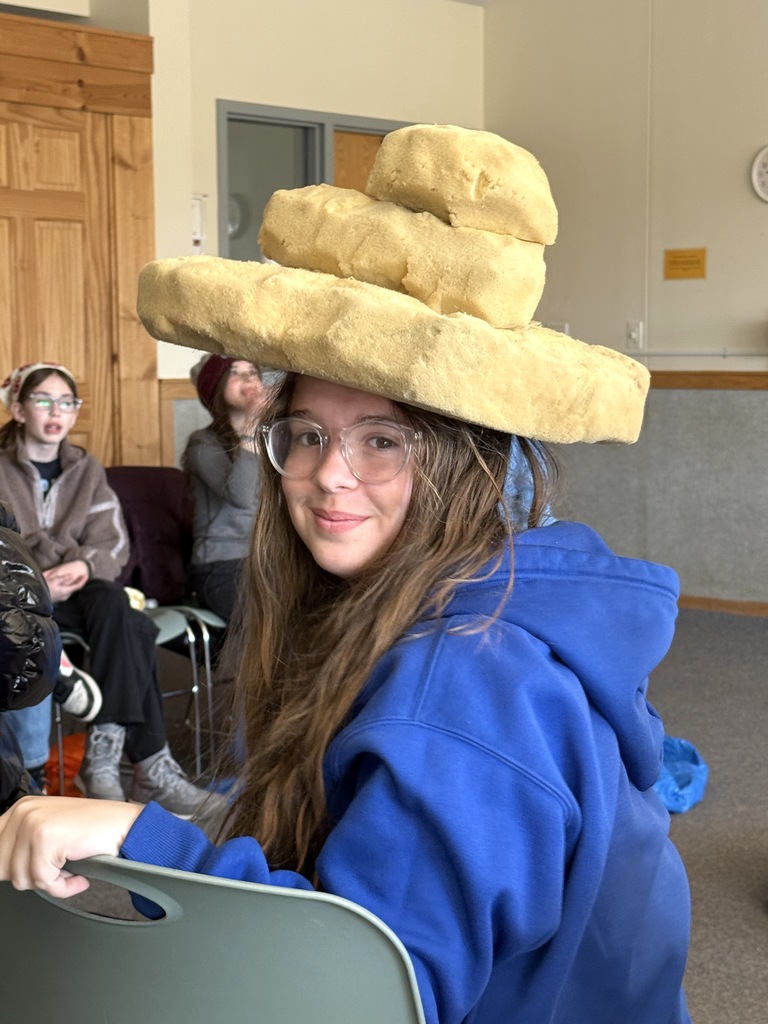 student in hat for weather play