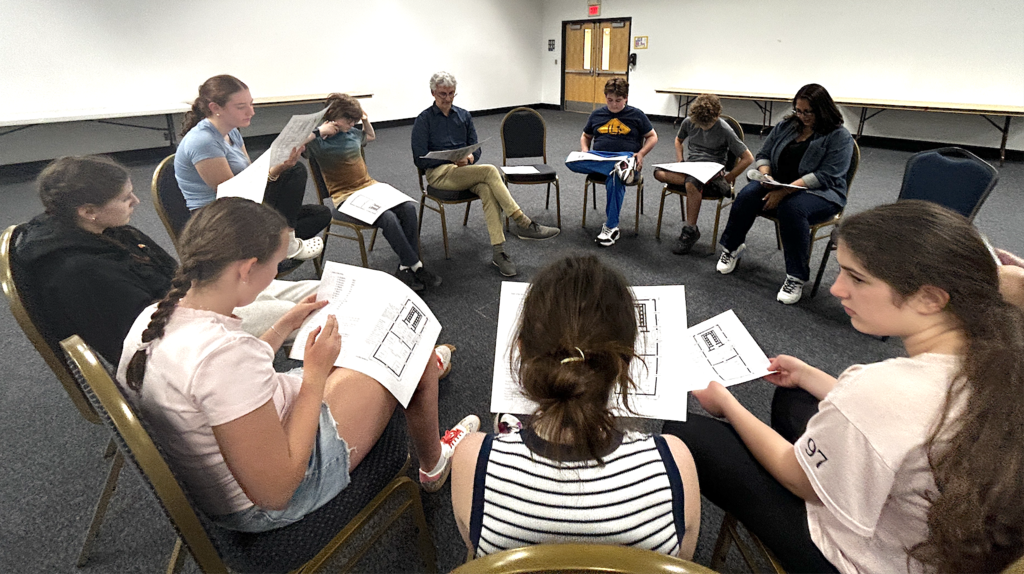 rabbi leads small group discussion with middle schoolers