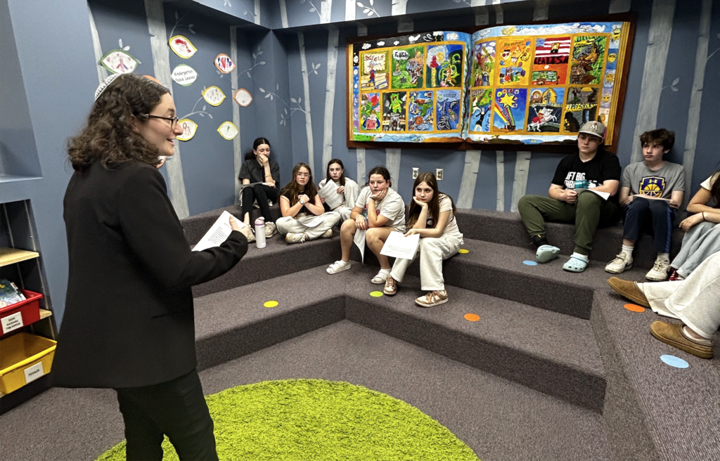 rabbi leads small group discussion with middle schoolers
