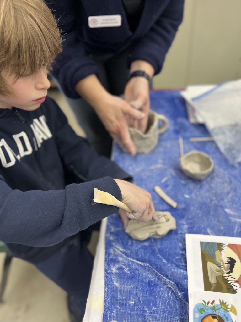 student etches design into clay