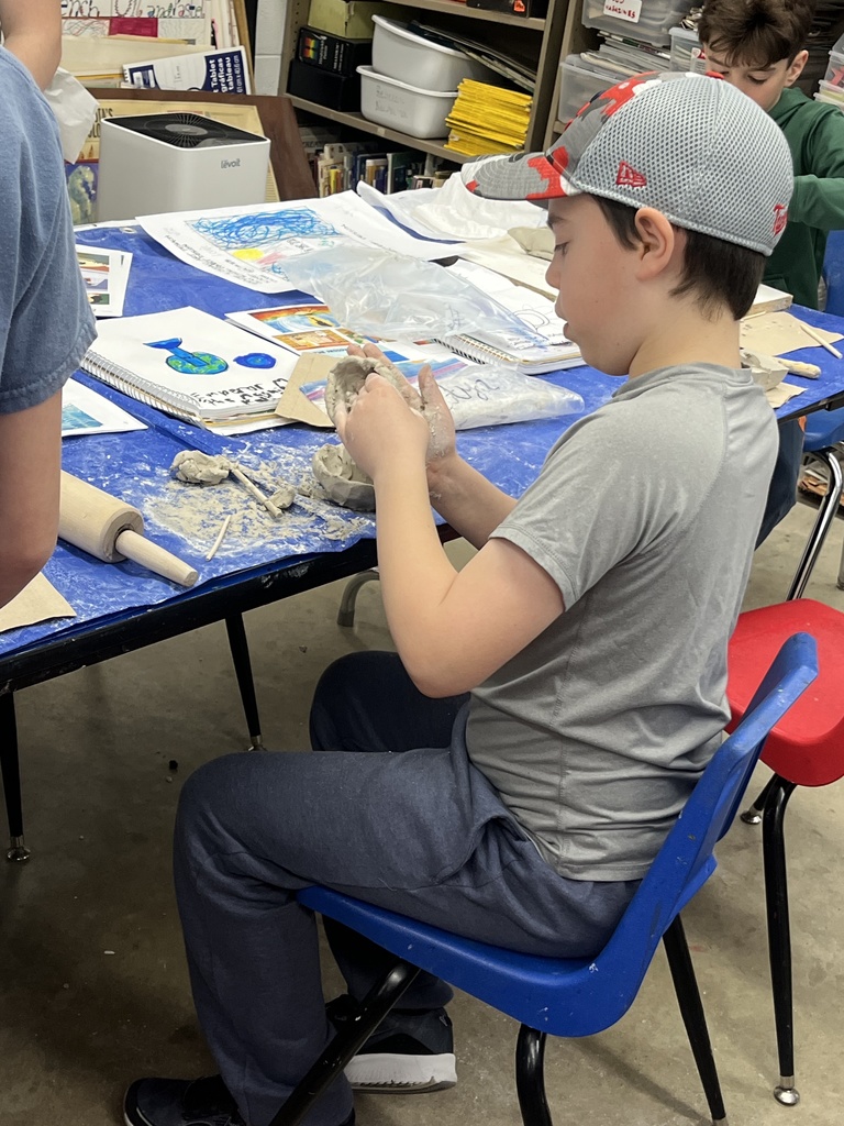 student builds clay bowl