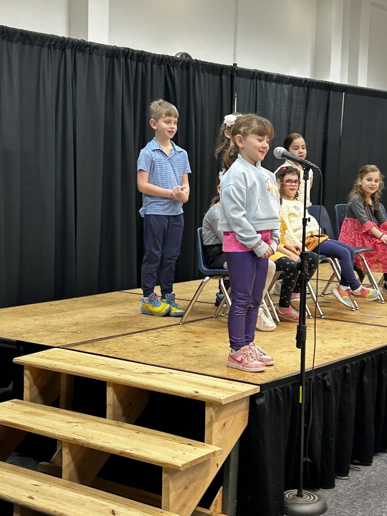 kindergartner at microphone