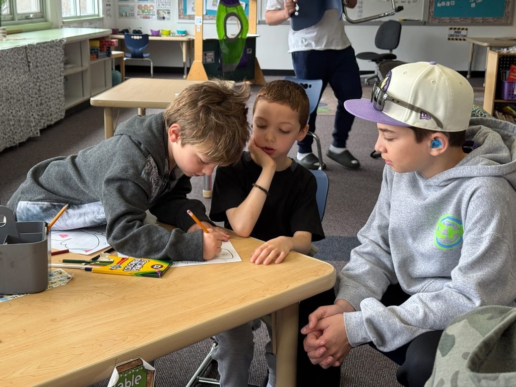 eighth grader helps kindergartners