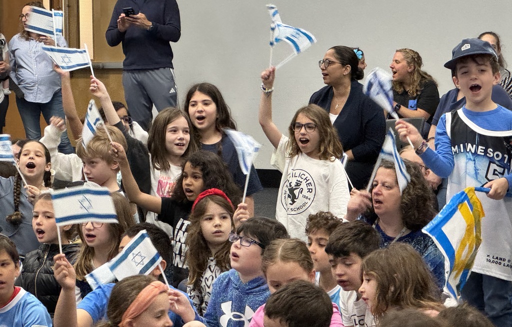 students wave Israeli flags