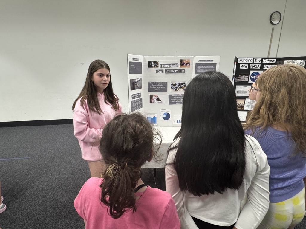 eighth grader presents to younger students
