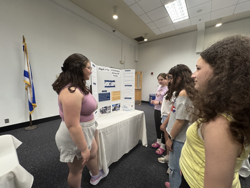 eighth grader presents to younger students