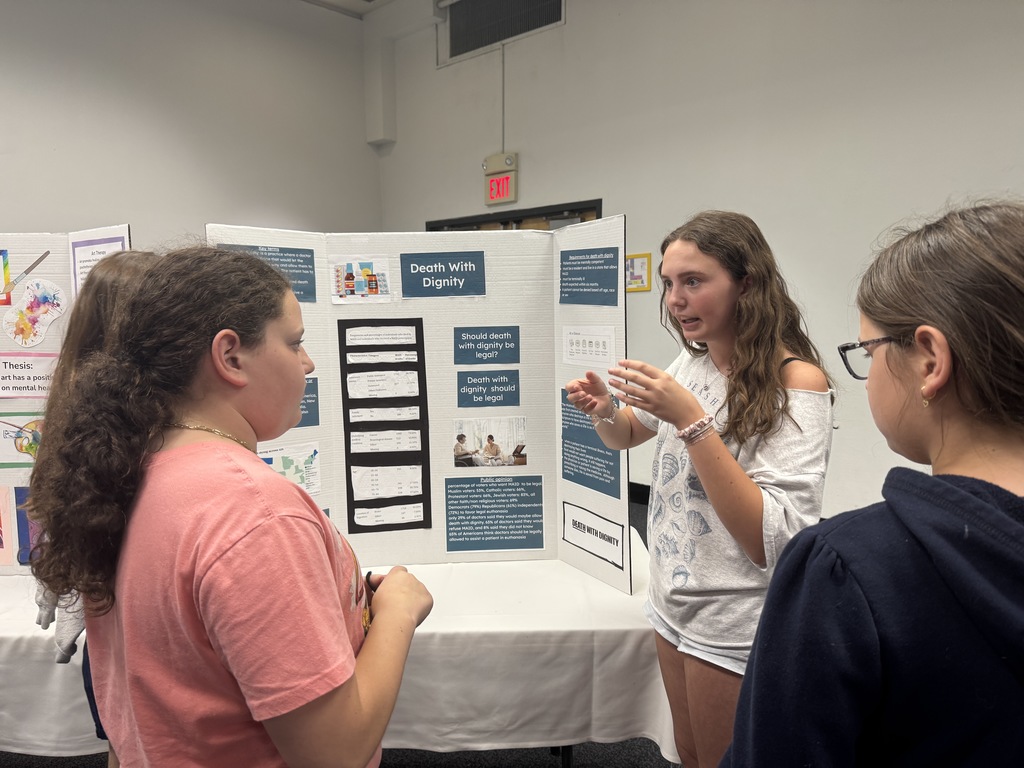 eighth grader presents to younger students