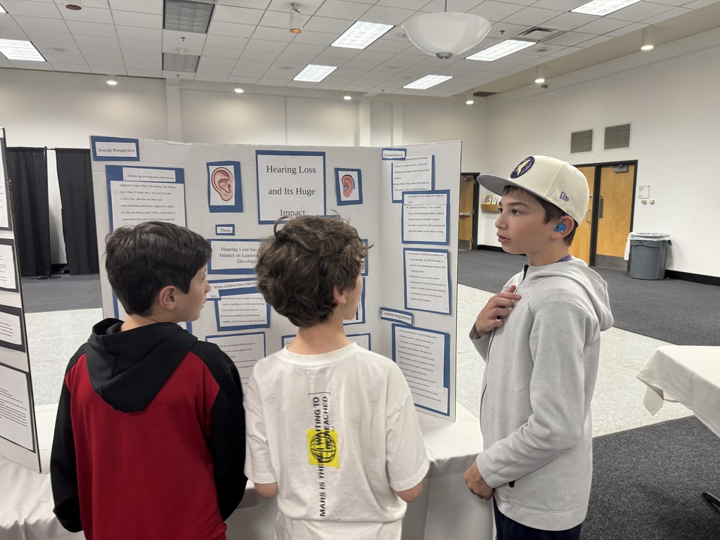 eighth grader presents to younger students