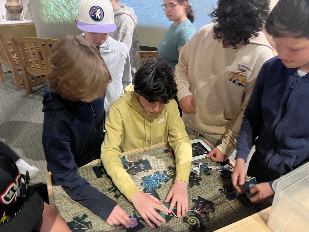 students work on puzzle